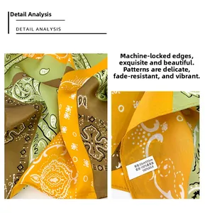 Detailed close-up of 53cm silk scarf showing paisley pattern and stitched edges