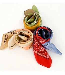 Three silk-feel satin neck scarves with paisley patterns in vibrant color assortments