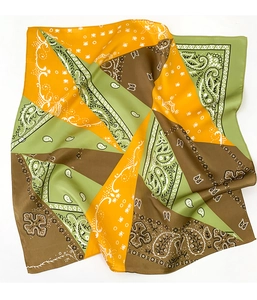 Detail view of a silk-feel square scarf with paisley patterns and geometric color blocking