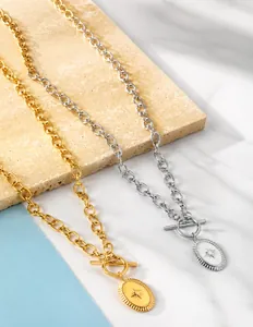 Detail of starburst oval pendant necklaces with toggle clasp in gold and silver finish