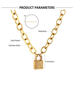 Detailed view of gold plated stainless steel lock pendant with sparkling white cubic zirconia