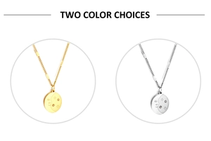 Detailed comparison of sun and moon oval pendants in polished gold and silver steel