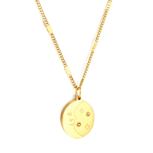 Oval gold stainless steel necklace with sun moon and star pendant on white background