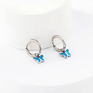 Minimalist silver stainless steel hoop earrings with delicate blue butterfly charms