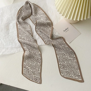 Pleated skinny scarf with vintage geometric patterns in brown and cream earth tones