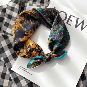 Artistic oil painting silk scarf with abstract print and blue border on white magazine