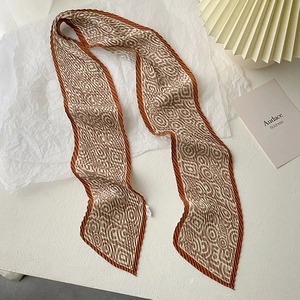 Pleated narrow silk scarf with retro geometric patterns in brown and cream colors
