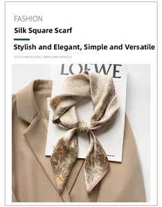 Detailed view of floral silk neck scarf elegantly tied on a beige blazer accessory