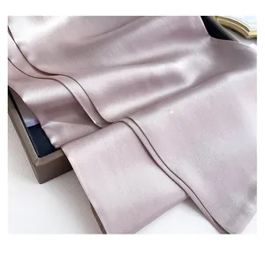 Macro shot showing light purple silk scarf texture with professional inner seam stitching