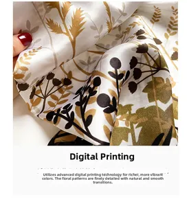 Detailed close-up of digital floral print on soft mulberry silk scarf held by hand