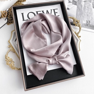 Elegant mauve silk scarf with a satin finish displayed in a luxury gift box