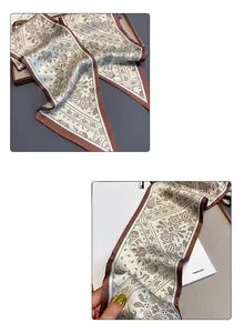 Detail of silk satin twilly scarf with vintage paisley print and fine stitching