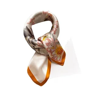 Elegant silk square scarf featuring realistic daisy prints and vibrant orange borders