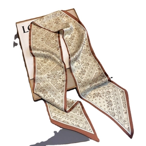 Beige and brown paisley pattern skinny silk scarf with elegant solid border detail