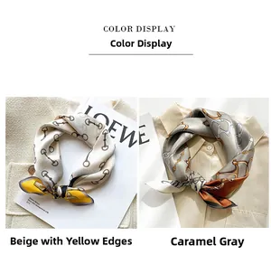 Detail view of silk scarves with horsebit and chain patterns in beige and caramel grey