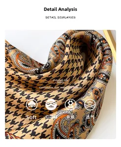 Close-up of golden brown faux silk scarf with houndstooth and paisley patterns
