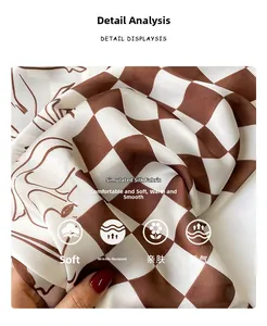 Detail of silk-like scarf featuring brown checkerboard pattern and retro artistic portraits