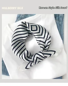 Detail of mulberry silk square scarf with black and white stripes on causal clothing