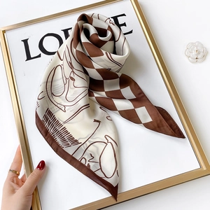 Checkerboard and line art portrait silk scarf folded inside a golden decorative frame
