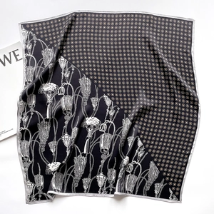 Detail of silk square scarf featuring yellow polka dots and vintage floral patterns