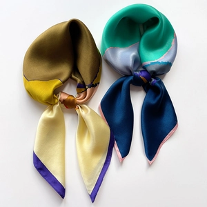 Elegant silk square scarf set with contrasting color block patterns and glossy texture