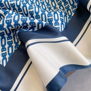 Navy blue and ivory silk-like square scarf with geometric chain patterns and satin finish