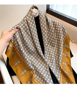 Detail of vintage violin print silk scarf with baroque gold patterns and grid design