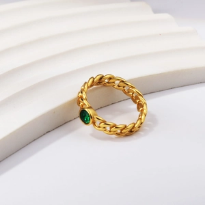 Retro Cuban link ring in gold finish featuring a central round green gemstone setting