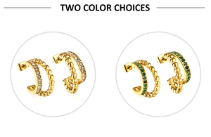 Detail view of gold earrings with two styles of cubic zirconia and green gemstones