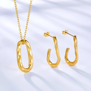 18k gold-plated stainless steel jewelry set with irregular molten texture and U-shape design