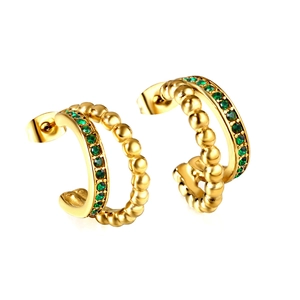 Luxury gold C-shaped hoop earrings with emerald green crystals and beaded texture finish