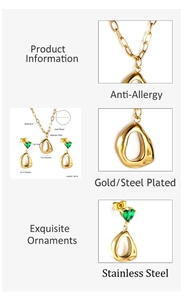 Detail view of gold heart necklace and earrings set with green stones and dimensions