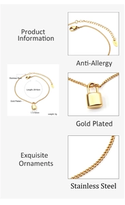 Detail view of gold-plated stainless steel lock charm with K18 stamp and chain links