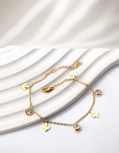 Detail of gold-plated cactus anklet featuring round zircon stones and lobster clasp closure