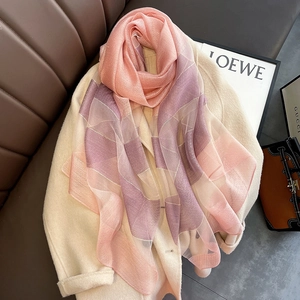 Detail showing pink and purple gradient silk blend scarf with subtle weave texture