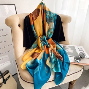 Elegant silk-like scarf with large abstract ginkgo leaves pattern for women