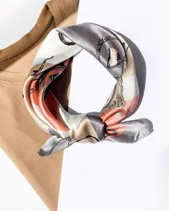 Detail of vintage carriage pattern on silk square scarf with elegant draping effect