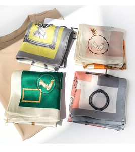 Detailed view of four retro silk scarves featuring European artistic prints and frame patterns