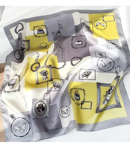 Detailed texture of silk scarf with vintage yellow and grey geometric pattern and hand-drawn icons