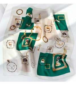Detail of vintage silk scarf featuring classical silhouettes and golden frame patterns