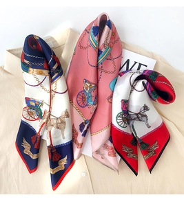 Detail of three silk square scarves with vintage horse carriage and chain patterns