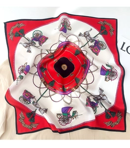 Detail of luxury silk square scarf featuring vintage carriage motifs and chain patterns