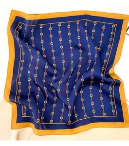 Detail showing smooth silk square scarf with classic horsebit pattern and stripe accents