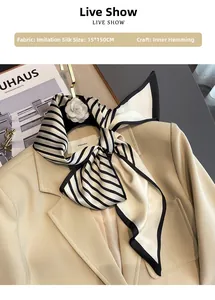 Detail of 15x150cm black and white striped faux silk scarf on a khaki suit blazer