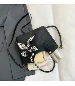 Detailed interior of a black litchi pattern tote bag showing its spacious capacity