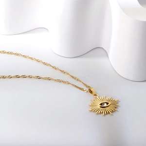 Collier vintage doré français avec pendentif œil solaire et chaîne ondulée