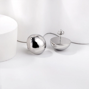Polished stainless steel geometric dome stud earrings for women on a minimalist pedestal