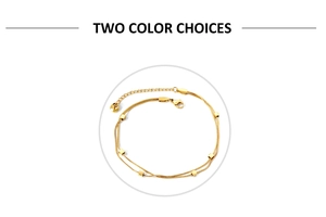 Close-up of double-layer gold snake chain anklet featuring square metallic slider beads