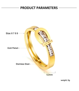 Detail of gold plated buckle ring with LOVE FOREVER engraving and inlaid white stones