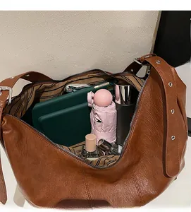Interior view of brown vintage tote bag showing spacious capacity for daily essentials
